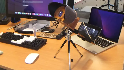 An iPhone in a 3D-printed holder, mounted on a Holmes stereoviewer